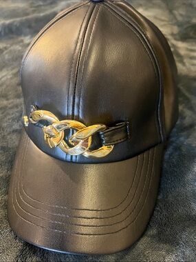 BCBG Black Faux Leather Cap with Gold Chain Detail